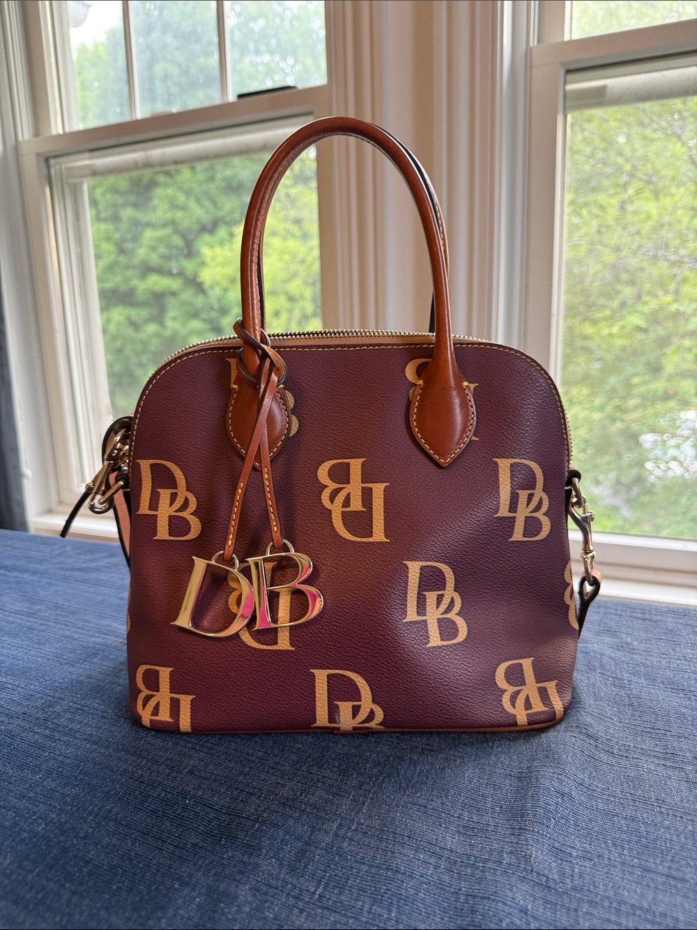 Dooney and Bourke Monogramed Domed Satchel- wine with dark brown leather trim